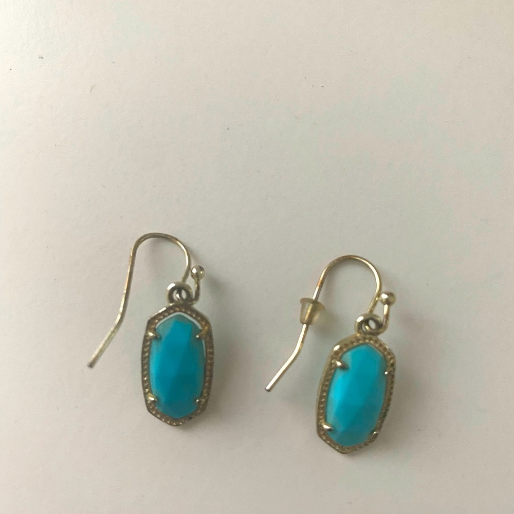 Kendra Scott turquoise earrings.